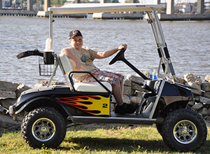 Kid In Golf Cart With Flames